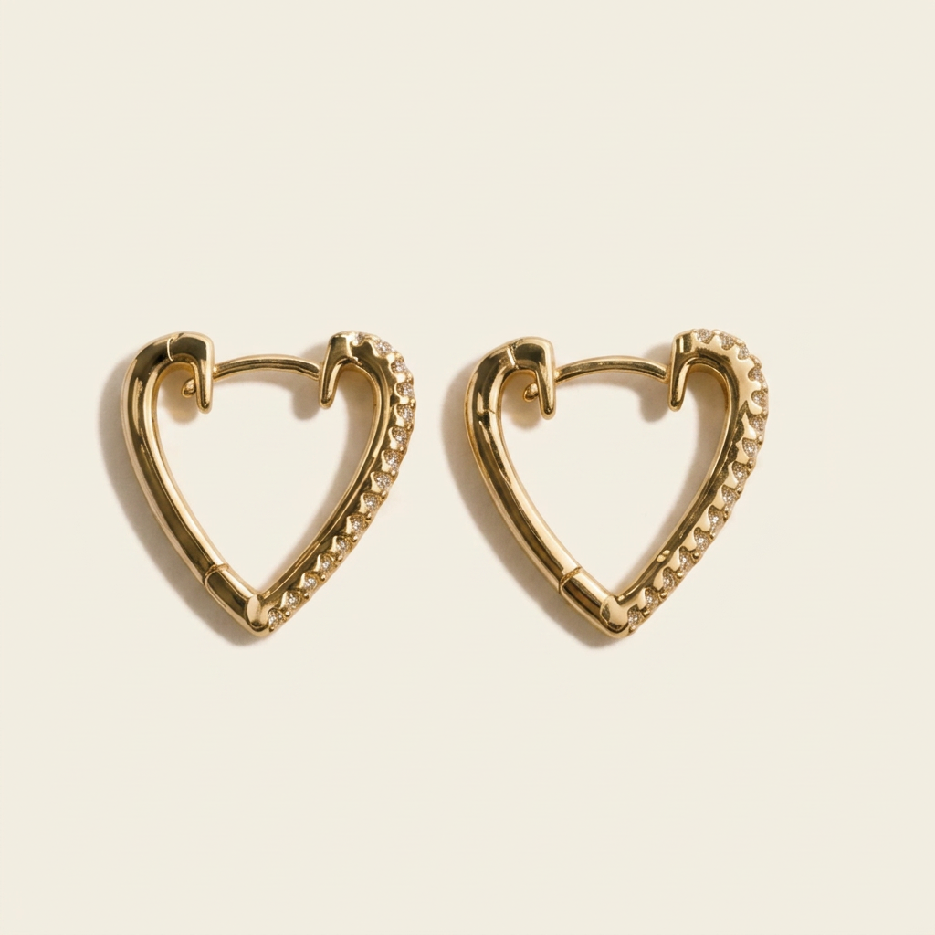 Gold heart hoops formatted on cream with soft shadows